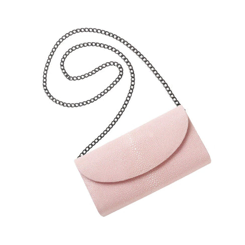 Pink handbag with a chain strap on a white background
