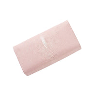 Pink textured clutch bag on a white background