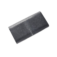 Black textured clutch bag on a white background