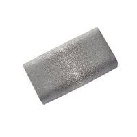 Rectangular clutch bag with a textured surface on a white background