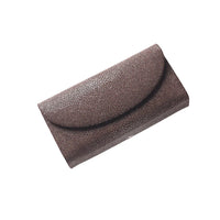 Brown textured clutch bag on a white background