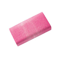Pink textured clutch bag on a white background