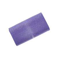 Purple clutch bag with a textured surface on a white background