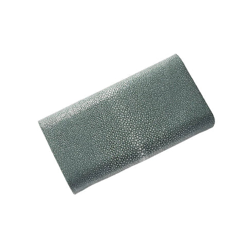 Green clutch bag with a textured surface on a white background